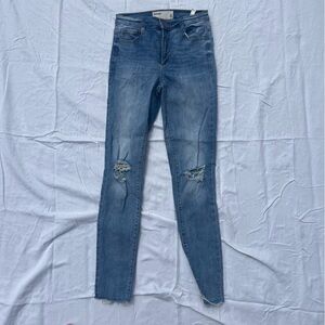 Garage distressed skinny jeans